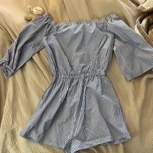 Aqua romper light blue and white striped. Elastic waistband and off the shoulder